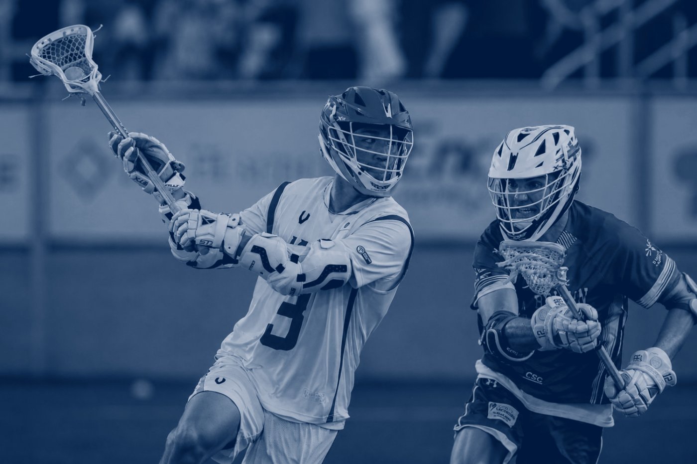 Lacrosse players competing for the ball